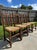 Antique carved oak side chairs in a Jacobean Revival or Arts & Crafts style. High slatted back with carved top crest,...