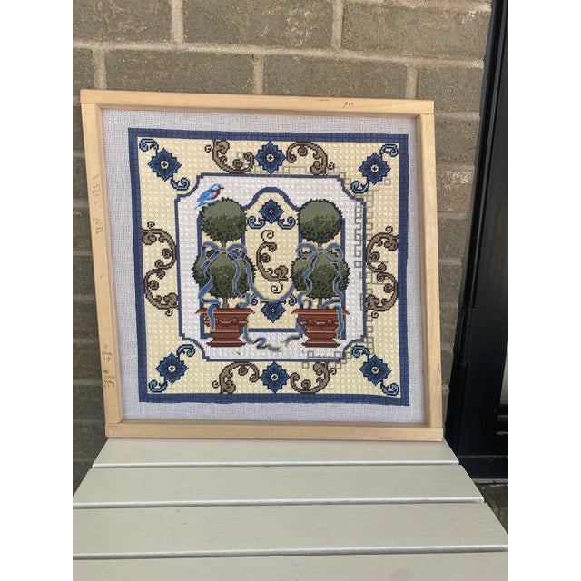 Gorgeous hand made cross stitch on working frame. Cross stitch is of topiaries and it can be framed and hung, made into a...