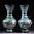 This exquisite pair of cloisonne enamel vases features a classic baluster form with a flared rim and a bulbous body. Each...