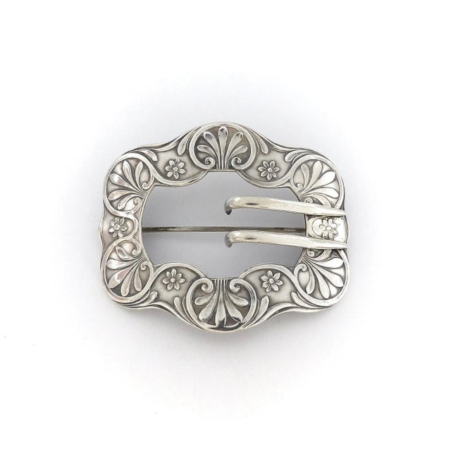 This converted Unger Brothers belt buckle can now be worn as a brooch. It is has a nice floral design, a classic Art...