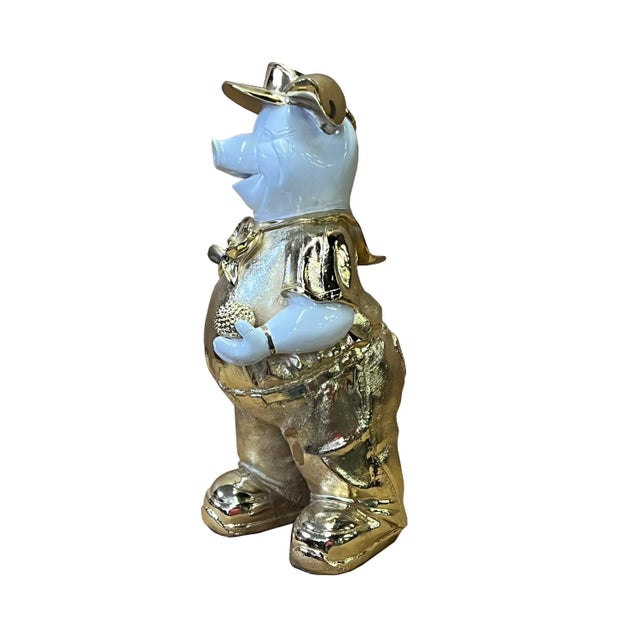 This is a decorative figure made of fiberglass and painted with white and golden color. Dimensions: 7"x 6" x h12.25"...