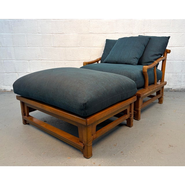 This vintage lounge chair with matching ottoman features a warm bamboo frame and deep, plush cushions upholstered in a...