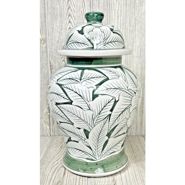 Enhance your home with the timeless beauty of this **large 11-inch lidded ginger jar**, featuring an elegant **sage green...