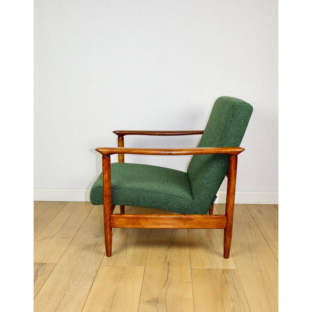 GFM-142 armchair, designed by Edmund Homa in the 1970s, upholstered in green boucle fabric. 2 pieces available. The...