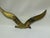 Bring an elegant touch of 1970s coastal modernism to your space with this striking vintage brass seagull wall sculpture....