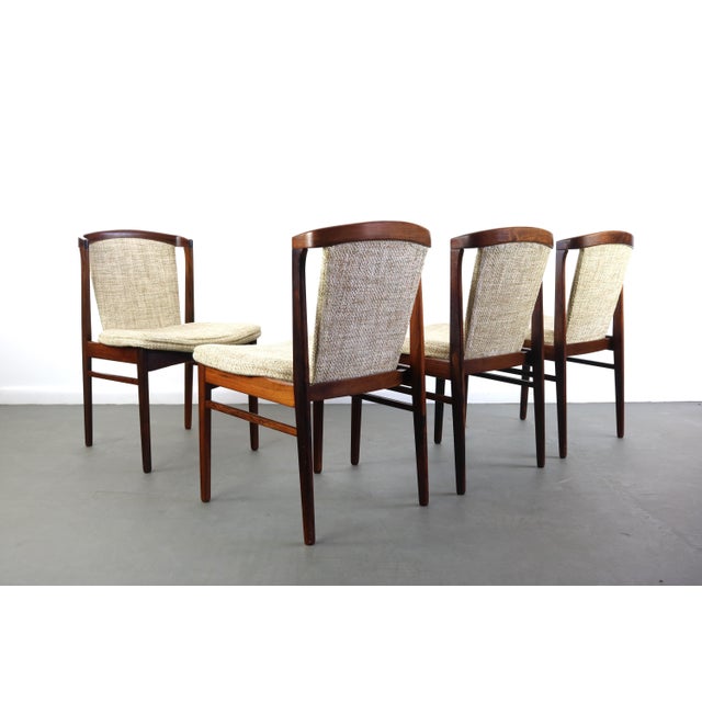 A truly beautiful set of 4 Danish modern solid rosewood dining chairs by Erik Buch for Orum Mobler. Extremely comfortable...