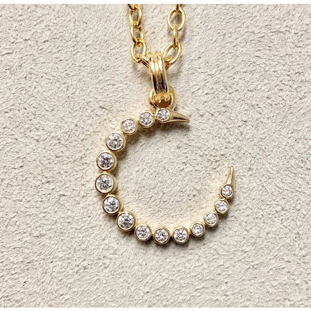 Created in 18 karat yellow gold Diamonds 0.30 ct approx Chain sold separately Crafted with 18 karat yellow gold, this...