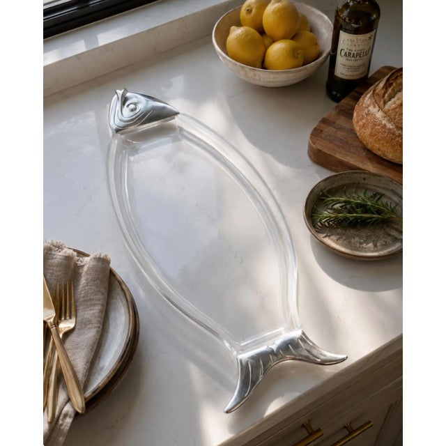 A striking example of 1970s modern design, this Grainware fish serving platter pairs crystal-clear lucite with sculptural...