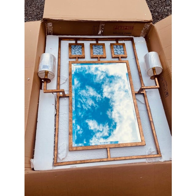 Enjoy the Avenue Mirror With Sconces in your home today! Modern simplicity is featured with our metal bronze-gold leaf...