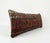 This beautiful 16'' x 47'' pillow cover was made from an authentic Turkish rug. Bright colors of wool adorn the front of...