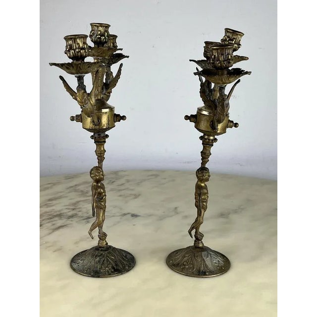 Pair of Italian bronze candelabra, 1960s Found in a noble apartment are intact and in good condition. Small signs of the...