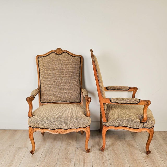 A pair of 19th-century Italian carved wooden chairs in transitional style. Seat height 19". Spot on one seat.