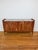 Cathedral Sideboard constructed in acacia wood featuring a marble top and brushed brass knobs. Interior with shelving (see...