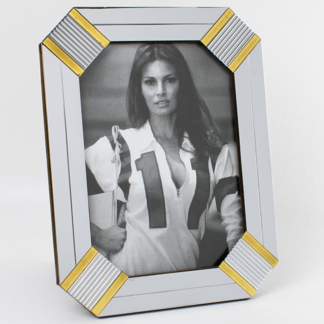 This lovely Noel BC chrome and brass picture frame, made in Italy circa 1970, is perfect for adding a touch of elegance to...