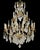 Fine gilt bronze chandelier in the French Louis XV style with 12 electrified candles and dozens of crystal glass pendants...
