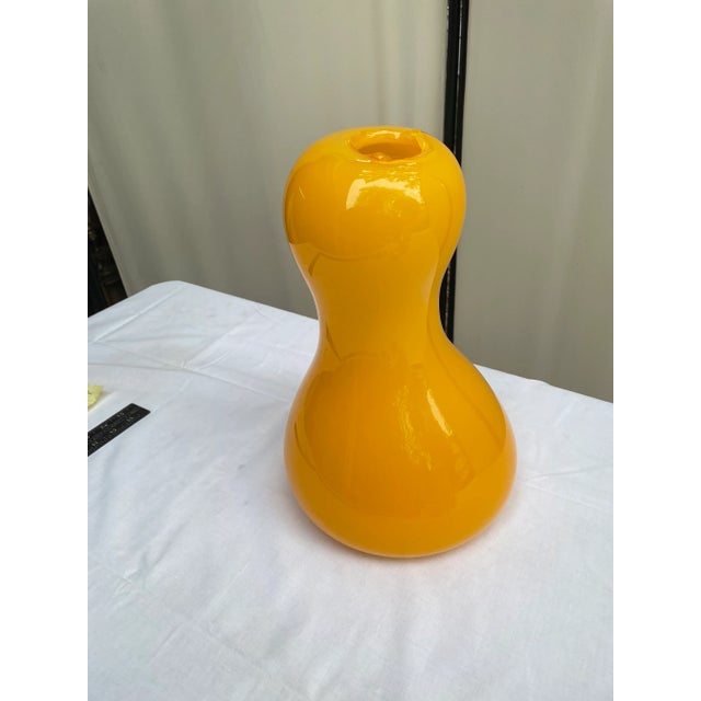 Vintage yellow glass free form hand blown vase. Signed on base.
