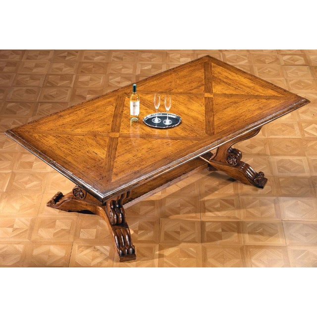 Handcrafted in Italy from solid walnut, this dining table features a beautifully inlaid top that highlights the natural...