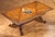 Handcrafted in Italy from solid walnut, this dining table features a beautifully inlaid top that highlights the natural...