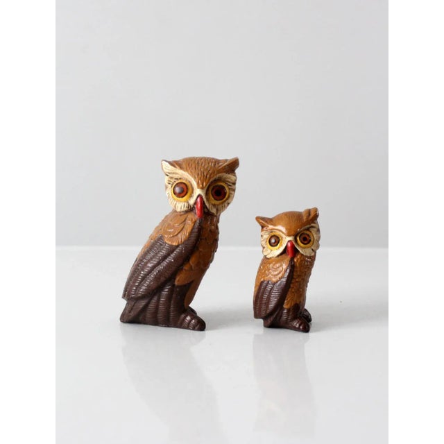 This pair of mid 20th century owl figurines is crafted in chalkware, featuring strong sculptural lines and vibrant...