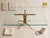 This is a vintage 1950s coffee table by Italian designer Duilio Barnabé (also known as Dubè), featuring a sculptural brass...