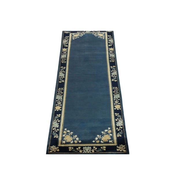 A 3x8 hand-knotted vintage runner connoting Chinese art deco inspirations of the 1920s, from the newest line of Rug &...