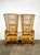Vintage pair of high back rattan lounge chairs. Tall rattan frames with leather wrapped joints and pencil reed rattan...