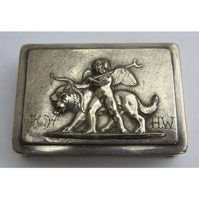 18th century or early 19th century silver plated patch box with delightful scene of Angel with lions. Beautifully engraved...