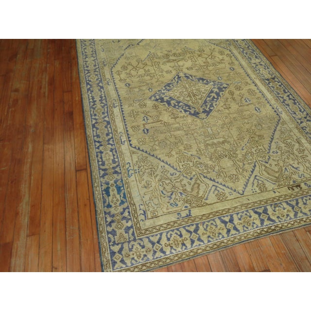 20th century intermediate size traditional rug in blue and taupe tones Measures: 4'6" x 6'10" / 1930s.