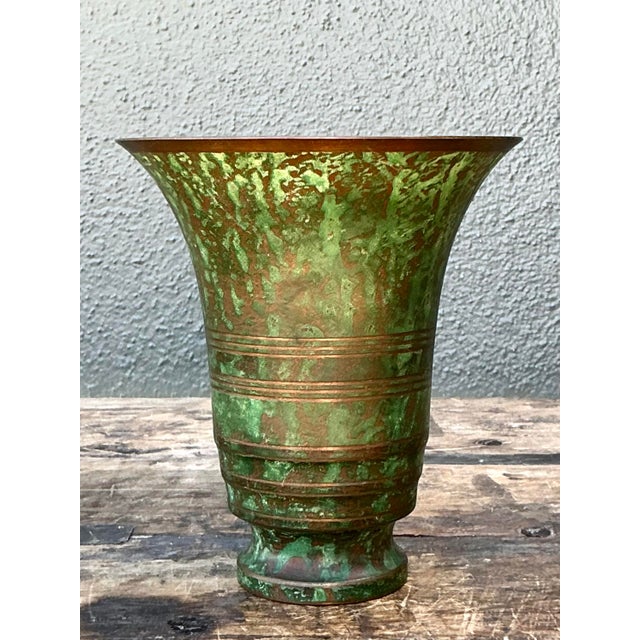 This exceptional vintage Carl Sorensen bronze vase is a striking embodiment of Art Deco elegance and artisanal metalwork....