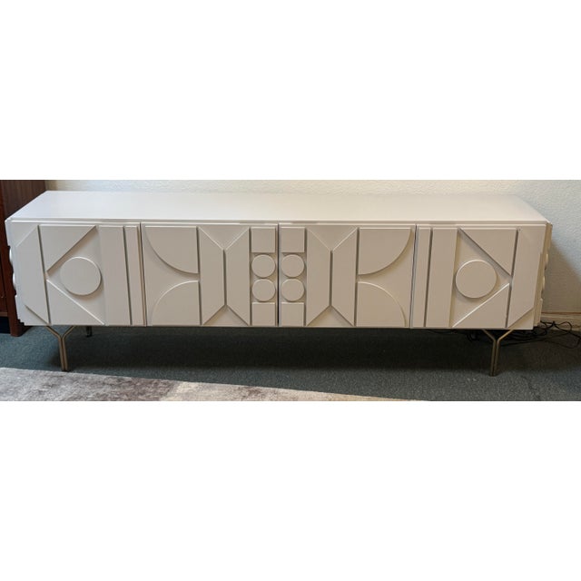 Design Plus Gallery the Carbon Pictograph Media Console by West Elm. This is a mid-century modern storage piece defined by...