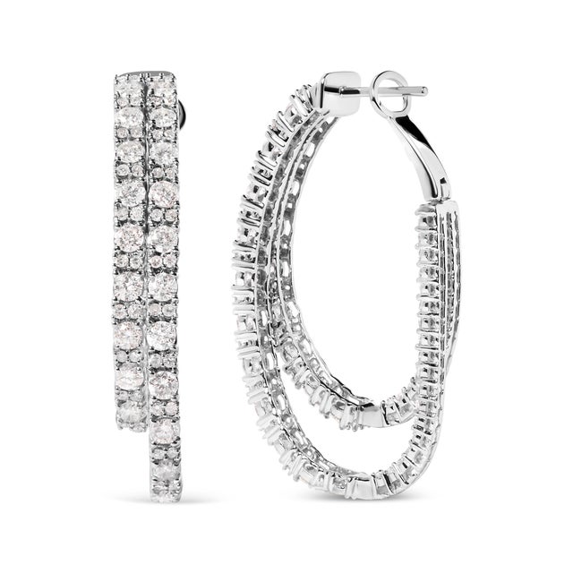 Indulge in the exquisite allure of these captivating 14K White Gold Diamond Asymmetrical Inside Out Double-Hoop Earrings....