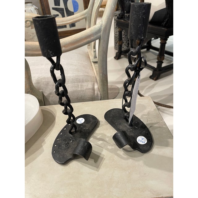 This distinctive pair of mid-century French candlesticks features a striking chain-link design crafted in black iron,...