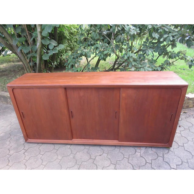 Low Sideboard with 3 Sliding Doors in Teak, Denmark, 1960s, in Very Good conditions. Designed 1960 to 1969