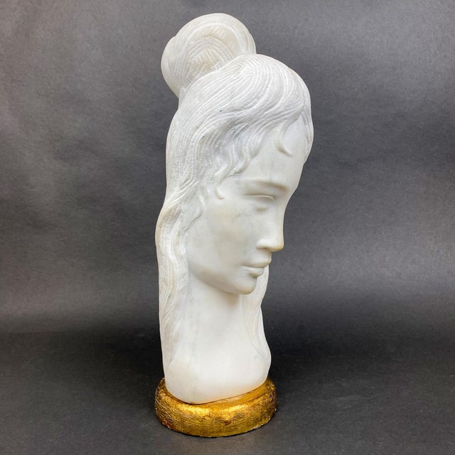 Beautifully detailed alabaster bust depicting a woman's face and marked with artist's initials R.P. Stamped Made in Italy...