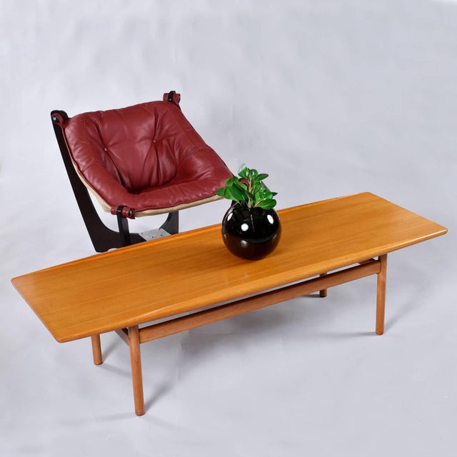 We are pleased to present this super rare Ole Wanscher Danish teak surfboard coffee table. Designed by Wanscher for Poul...