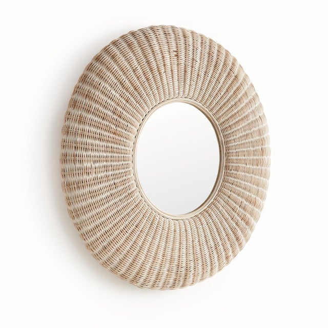 Made with signature artisan craftsmanship, this wellscaled mirror is intricately woven with premium rattan, creating a...