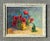 This vintage painting of vibrant poppies on canvas offers a captivating glimpse into the timeless beauty of still life...