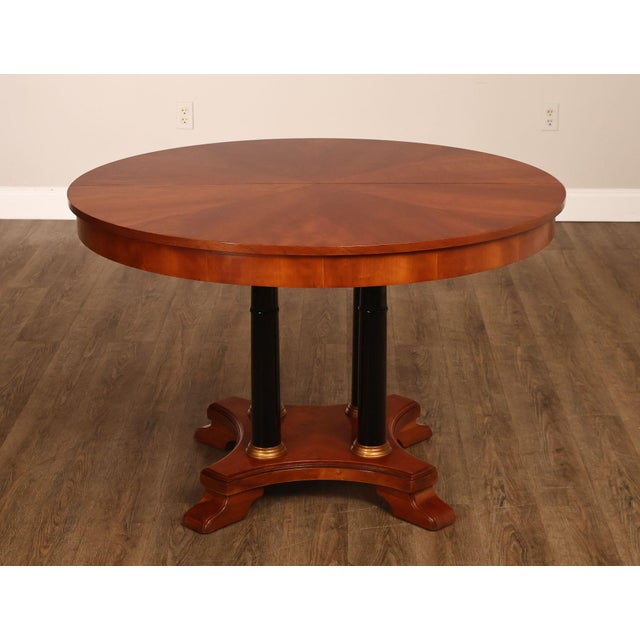 High Quality Cherry Pedestal Expandable Round Top Dining Table Supported by Ebonized Columns, Includes Two Leaves and Cover