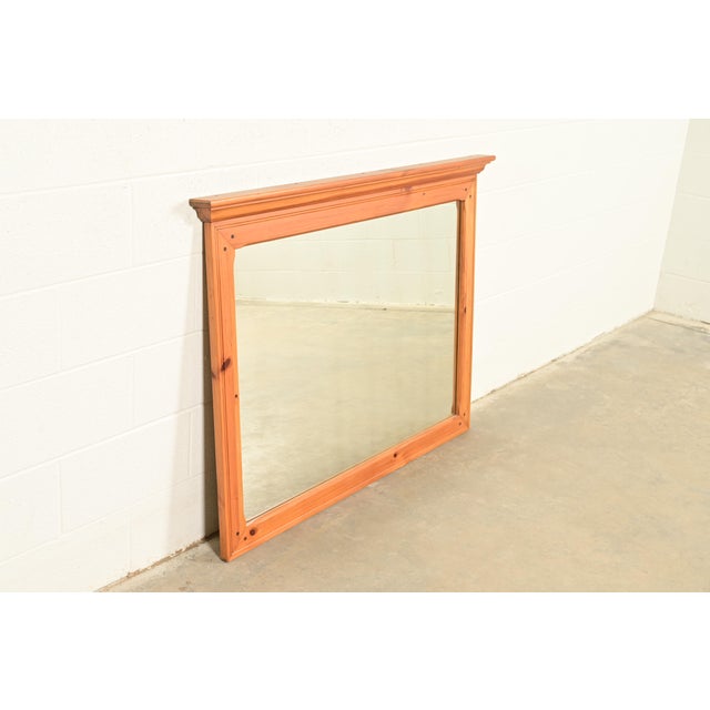 A gorgeous American Colonial or Country Farmhouse style solid pine framed wall mirror By Ethan Allen USA, Late 20th...