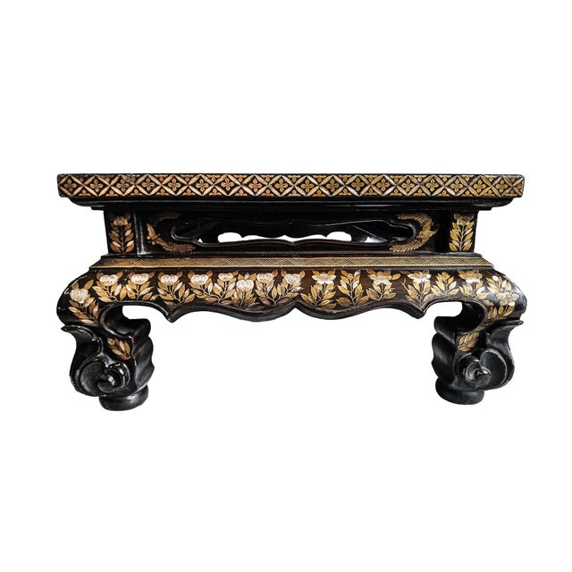 An antique Japanese table with inlaid mother-of-pearl (Raden) and gold maki-e over brown lacquer. Japan, late Edo period,...