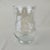 Hand-blown clear glass hurricane vase featuring a unique seeded texture and raised swirl ribbon detailing. This elegant...