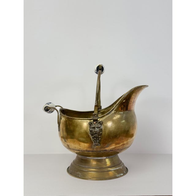Add a touch of antique charm to your home with this early 20th century brass and porcelain coal scuttle in a classic...