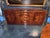 Elegant MCM sideboard crafted in rich burl walnut, accented with refined brass hardware. Designed with clean lines for...