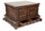 A robust and characterful wooden coffer of rectangular form, raised on a molded plinth base with shaped apron. The façade...