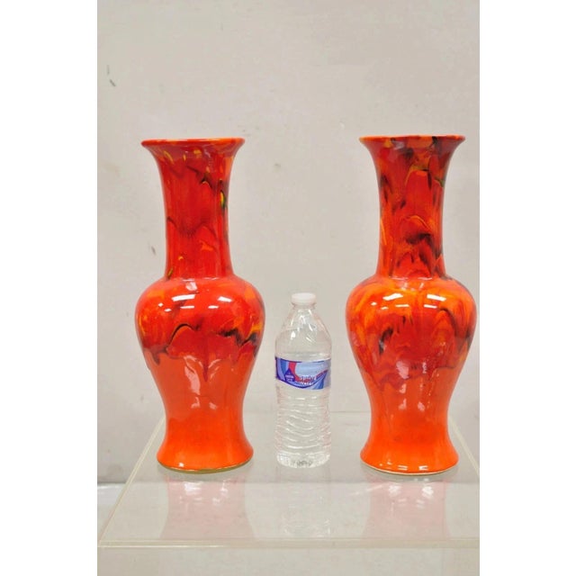 Vintage Red Lava Drip Glazed Mid Century Modern Ceramic Pottery Vessel Vases - a Pair. Circa Mid 20th Century....