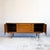 A handsome low sideboard from Nathan's sought-after Citadel range, with rich teak colouring and beautifully figured grain...