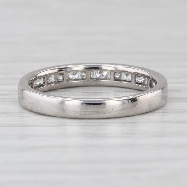 This lovely wedding band comes with an IGI report copy. The report is for an engagement ring and the wedding band but the...