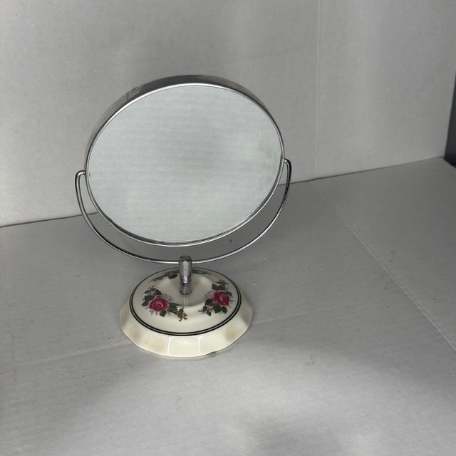 This exquisite Mid-Century vanity mirror represents the perfect marriage of functionality and decorative artistry...