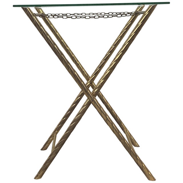 Folding coffee table and stand in faux brass bamboo manufactured in the 1960s. This fantastic table is like we have never...