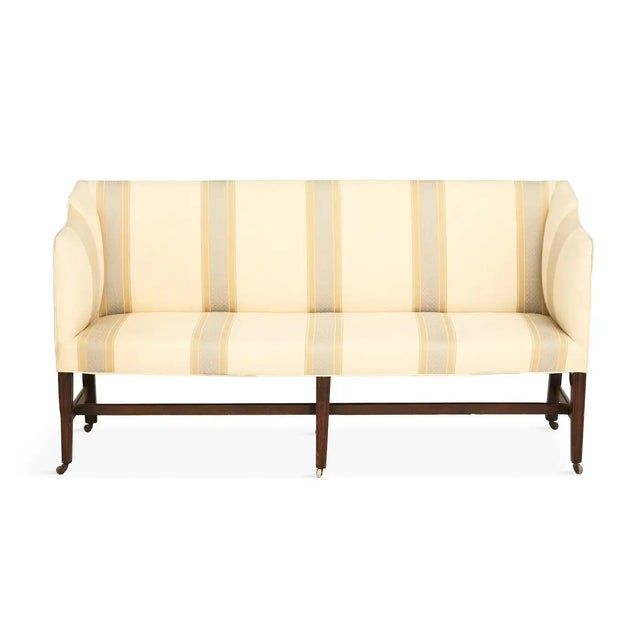 George III Upholstered Mahogany Sofa Hepplewhite 19th century, the padded rectangular back joined by downswept arms to the...